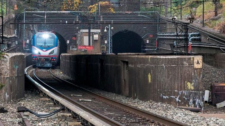 An Amtrak locomotive emerges from the North River