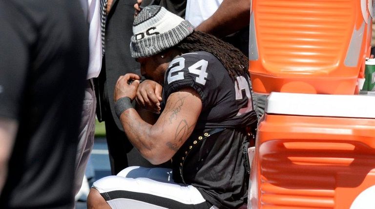 Oakland Raiders running back Marshawn Lynch sits during