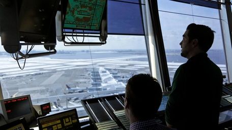 Air traffic controllers in the tower at Kennedy
