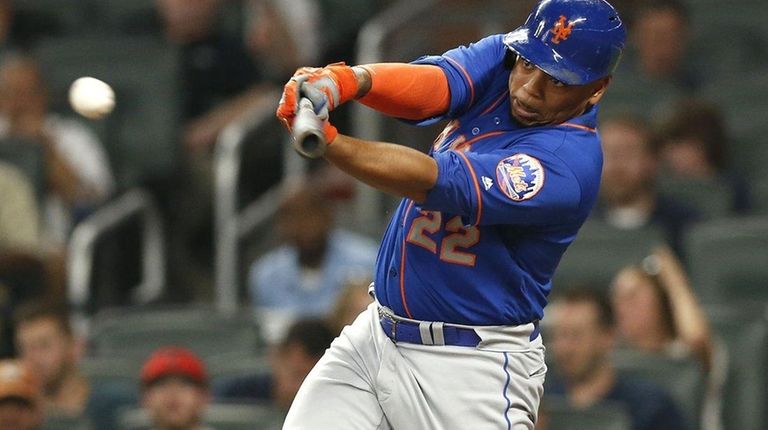 Mets first baseman Dominic Smith hits an RBI