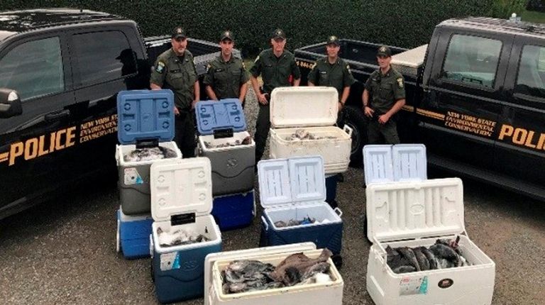 Officers from the Department of Environmental Conservation, marine