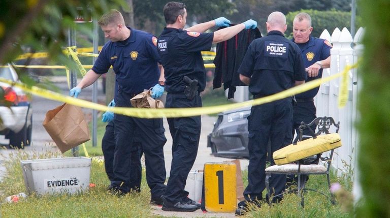 Nassau County police investigate the scene early Saturday,