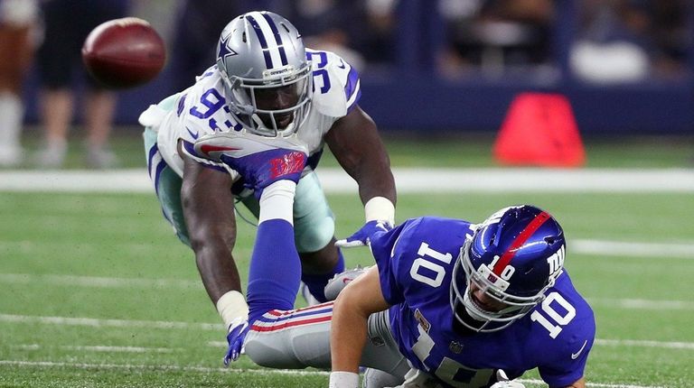 Benson Mayowa of the Cowboys knocks Giants