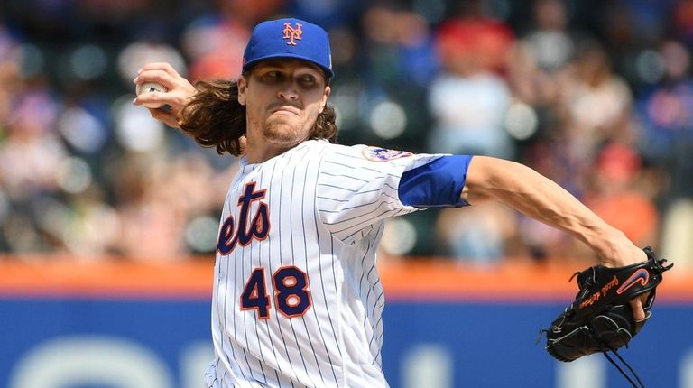 New York Mets starting pitcher Jacob deGrom delivers
