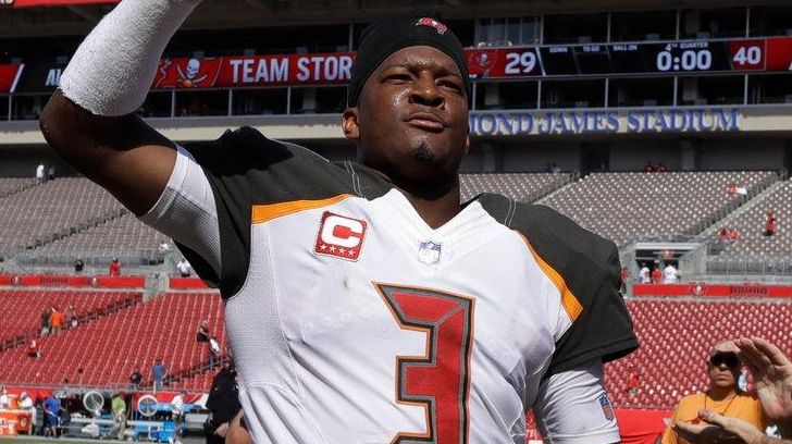 Buccaneers quarterback Jameis Winston raises his fist as