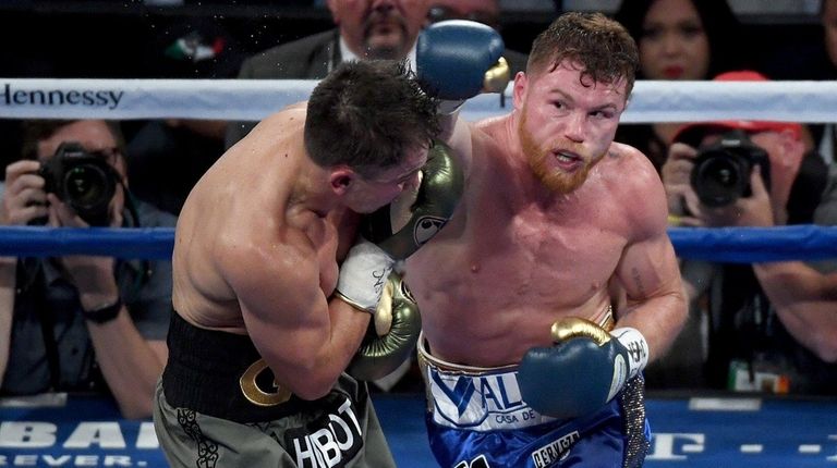 Canelo Alvarez throws a punch at Gennady Golovkin