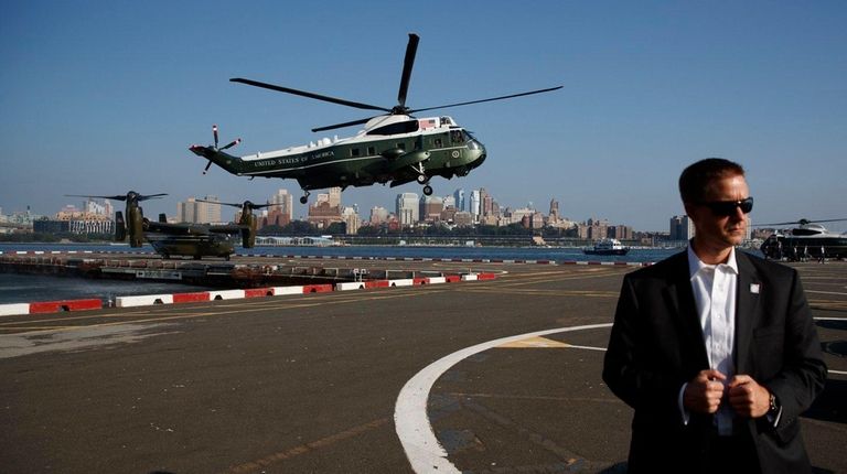 Marine One, carrying President Donald Trump, lands at