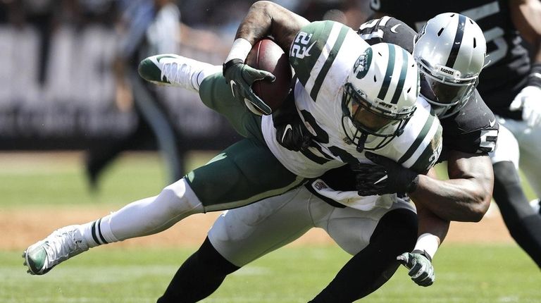 Raiders outside linebacker Bruce Irvin tackles Jets running back