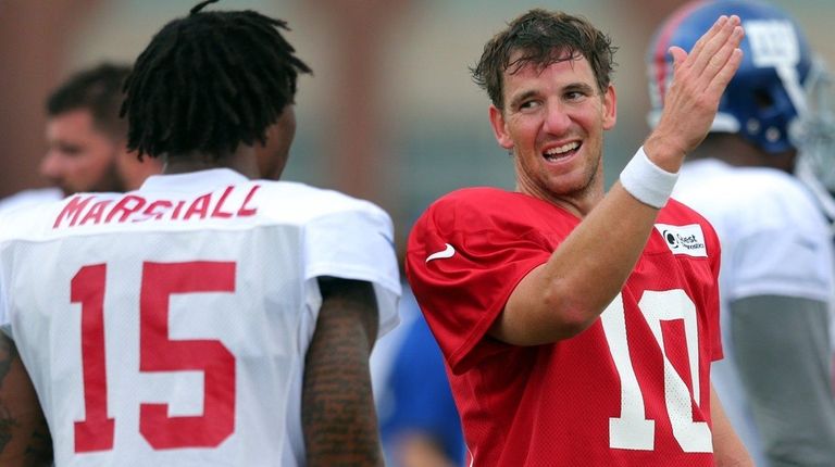 New York Giants quarterback Eli Manning (10) talks