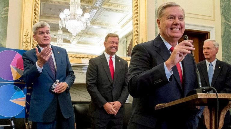 From left, Sen. Bill Cassidy (R-La.), Sen. Dean