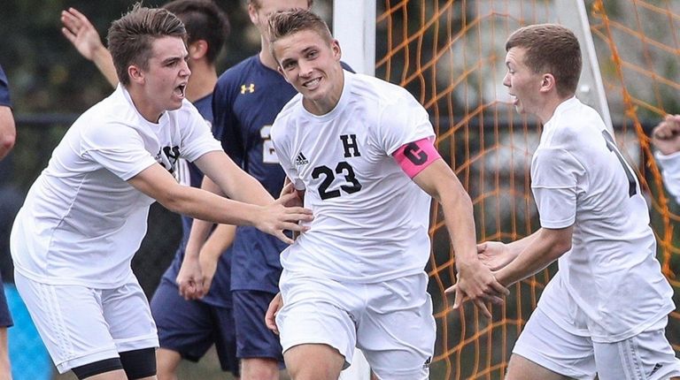 Hicksville's Stone Strongin gets congratulated after his goal