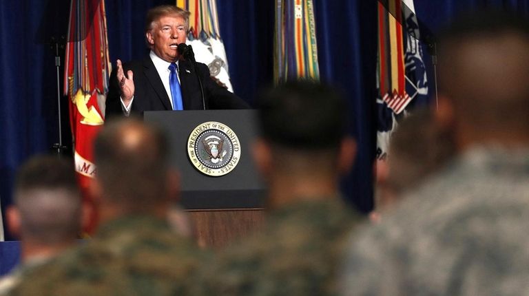 President Donald Trump talks about the U.S. troop