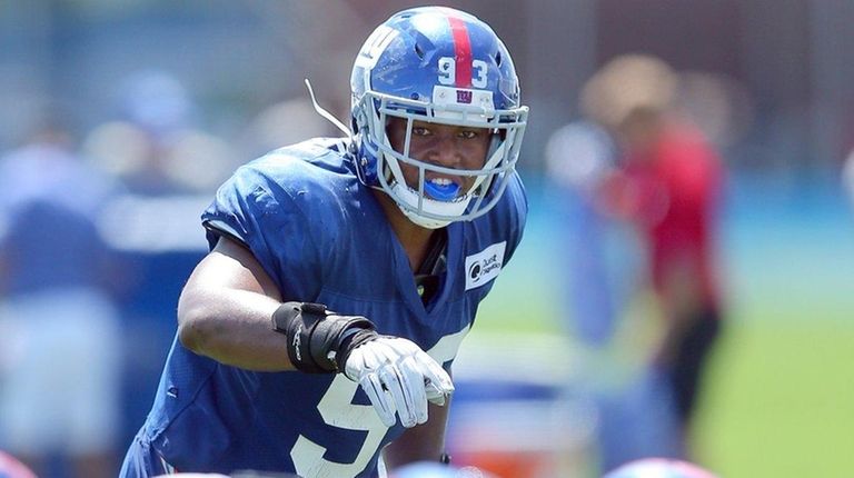 Giantslinebacker B.J. Goodson signals to the defense during