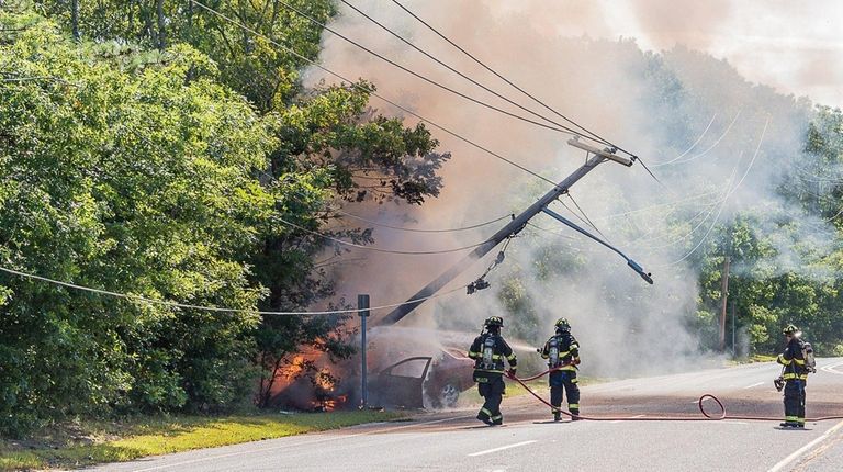 Firefighters at a crash on Moriches Middle Island