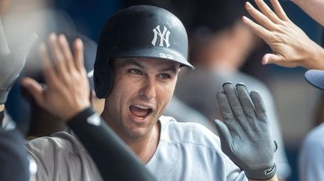 Yankees first baseman Greg Bird celebrates after hitting a