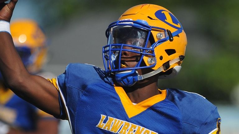 Lawrence quarterback Christian Fredericks #1 throws a pass