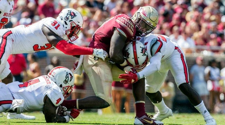 Florida State's Jacquez Patrick grimaces as he's hit