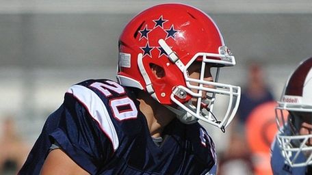 Benny Orlando #20 of MacArthur races downfield during