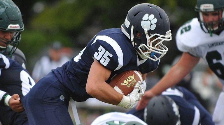 Justin Gerdvil #35 of Northport fights for yards