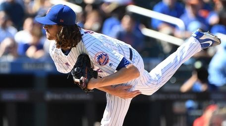 New York Mets starting pitcher Jacob deGrom delivers