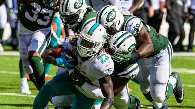 Jets defense suffocates Miami Dolphins running back Jay