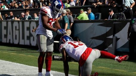 New York Giants' Odell Beckham, right, celebrates with