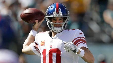 New York Giants' Eli Manning passes during the