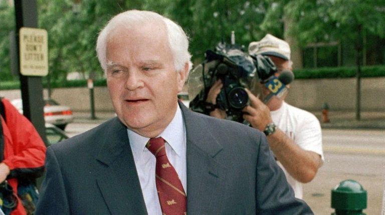 Pennsylvania Rep. Joseph M. McDade holds hands with