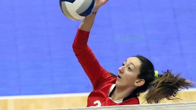 Connetquot's Cassandra Patsos hits across court during the