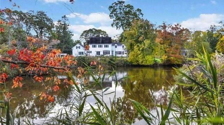 The two-acre property in Bayport features a private