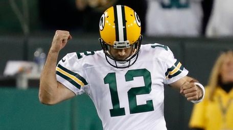 Green Bay Packers' Aaron Rodgers celebrates a touchdown
