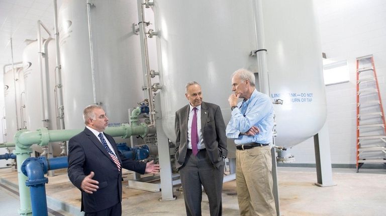 Bethpage Water District Superintendent Mike Boufis, left, gives
