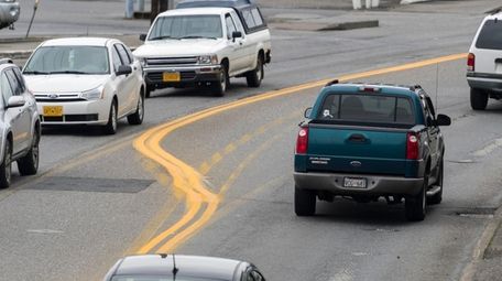 Cars on the Tongass Highway in Alaska.