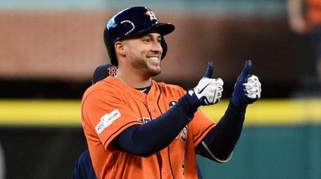Houston Astros' George Springer celebrates after hitting a