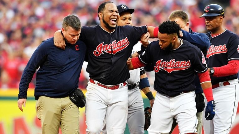 Edwin Encarnacion of the Cleveland Indians receives medical