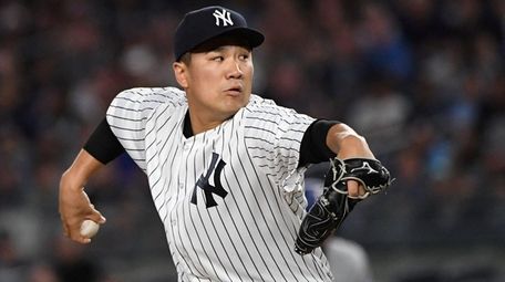 New York Yankees starting pitcher Masahiro Tanaka delivers