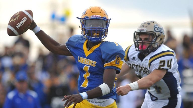 Christian Fredericks #1, Lawrence quarterback, left, scrambles to