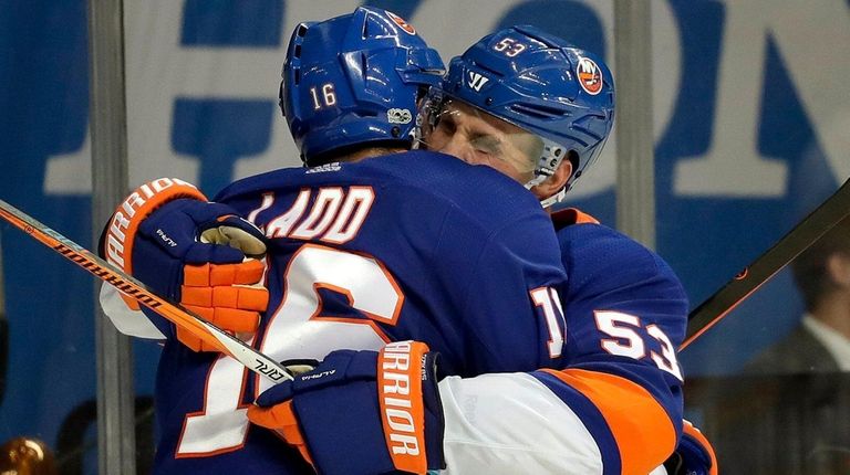 Islanders left wing Andrew Ladd celebrates with center