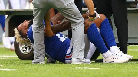 Odell Beckham Jr. is tended to after he