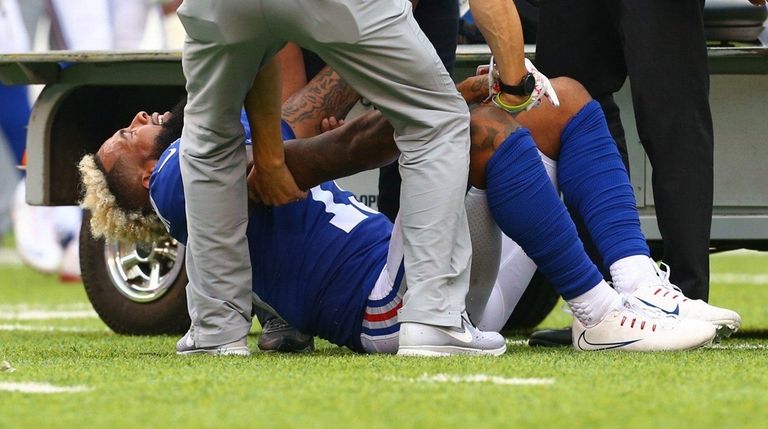 Odell Beckham Jr. is tended to after he