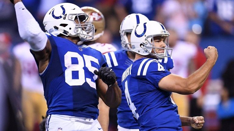 Adam Vinatieri of the Colts celebrates after making