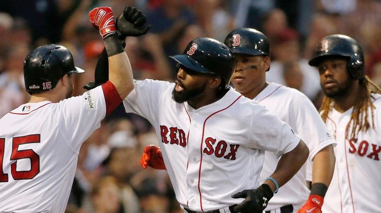 Jackie Bradley Jr., center, is greeted at home