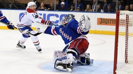 Rangers goaltender Henrik Lundqvist makes a save on Brendan