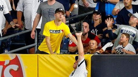 Aaron Judge catches a long fly ball by