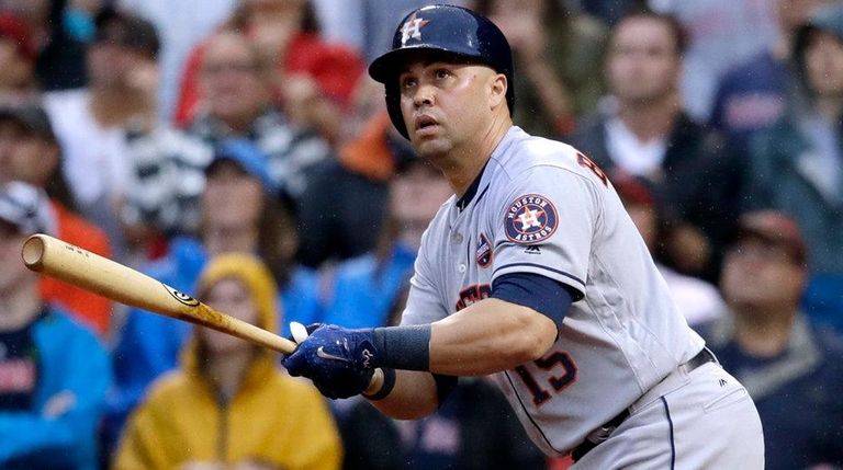 Astros designated hitter Carlos Beltran watches his RBI