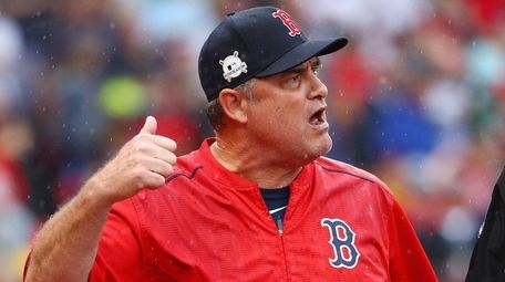 Red Sox manager John Farrell argues a call