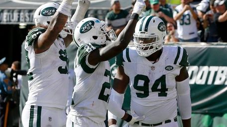 Kony Ealy (94) of the Jets celebrates his