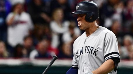The Yankees' Aaron Judge flips his bat after