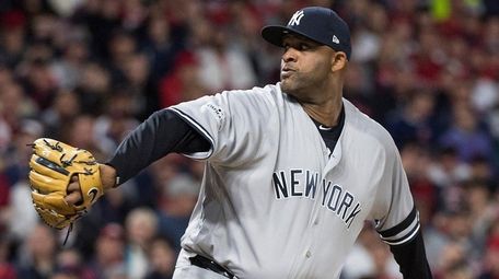 Yankees starter CC Sabathia delivers a pitch against the Cleveland
