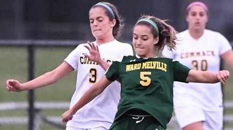 Ward Melville's Nicole Hauss kicks the ball against